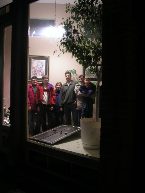 Nancy, David, Sarah, John, Brian and Scott looking into the apartment entrance of the Lauer Building Apartments