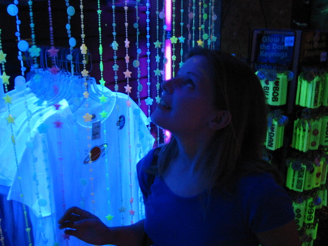 Sarah, in a black light room at the Mall of America