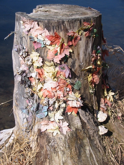 Those leaves are fake and stapled to the stump.  No, I don't understand either.